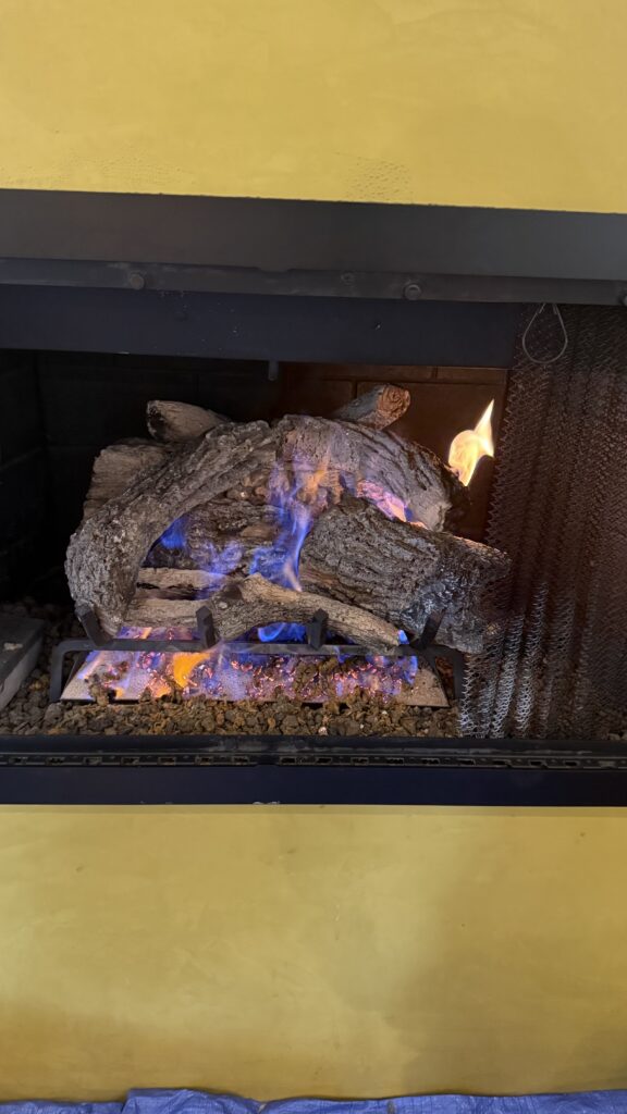 Gas fireplace repair in San Francisco Bay Area adjusting burner and ignition components