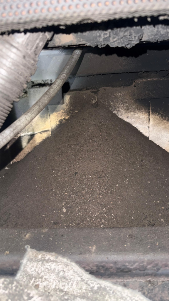 Pile of soot removed from flue during chimney cleaning in the San Francisco Bay Area